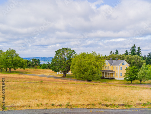 Yellow historic house with porch in Washington state