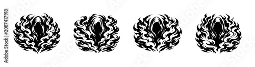 фотографія Four stylized black grim reapers with fiery halos on a white background