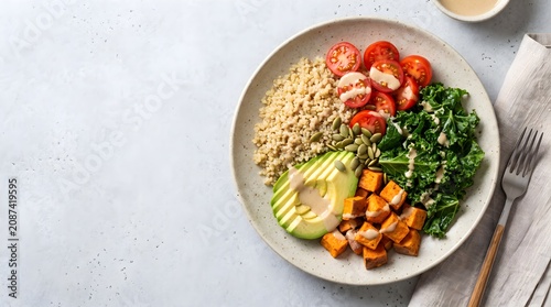 Healthy vegan buddha bowl with quinoa avocado and roasted sweet potato