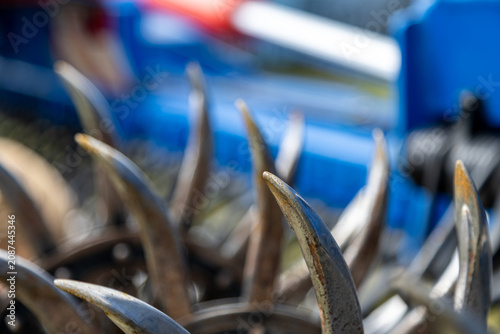 Obraz na plátně Rotary harrow curved metal tines mounted on cultivator frame for soil preparatio