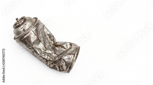 Crushed metal spray can discarded on a white background  