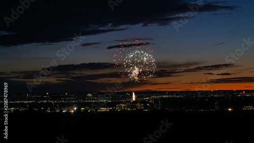 Fireworks over the Rio Grande Valley for the 250th birthday of the USA near Albuquerque New Mexico at sunset