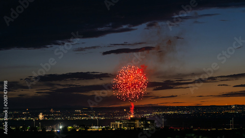 Fireworks over the Rio Grande Valley for the 250th birthday of the USA near Albuquerque New Mexico at sunset