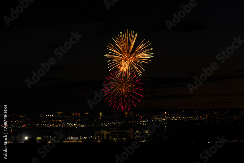 Fireworks over the Rio Grande Valley for the 250th birthday of the USA near Albuquerque New Mexico at sunset