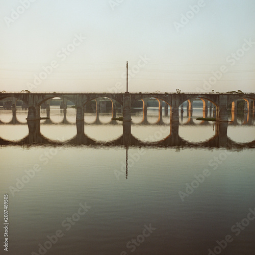 Bridge over a calm river captured on medium format film