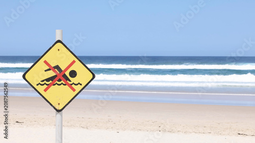 Quadro su tela Yellow No Swimming Warning Sign on Byron Bay Beach