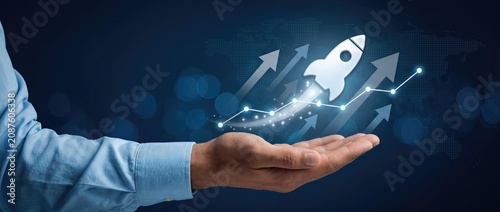Hand holding a launching rocket symbolizing growth and innovation in business and technology with a dark background and graphical elements representing progress