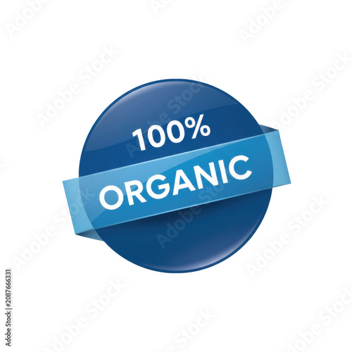 Cerulean blue circular badge with a diagonal ribbon and the white text 100 percent organic on a neutral grey background conveying a premium certification concept