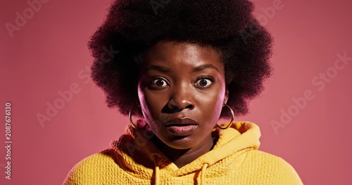Surprised Black Woman in Yellow.