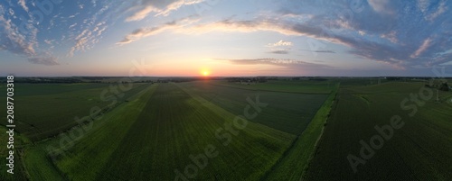Bild auf Leinwand Panorama picture perfect sunset high over the rolling corn fields of Eastern Iowa