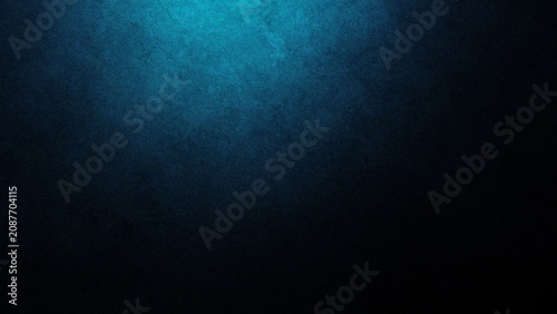 Mysterious Halloween atmosphere with a subtle blue spotlight against a dark textured background suggesting an eerie night