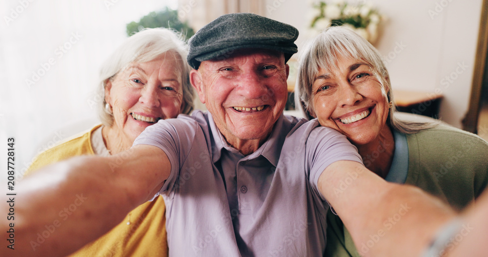 Fototapeta premium Portrait, selfie and smile of elderly people in retirement home together for bonding or memories. Community, happy and photograph with group of senior friends in apartment for social media or visit