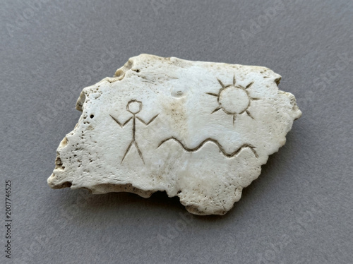 Abstract symbols carved on bones in ancient times