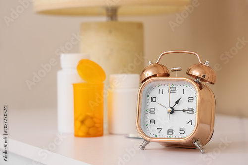 Alarm clock with pills and ...