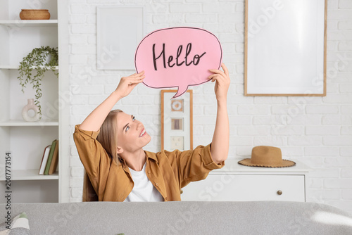 Young woman holding speech ...