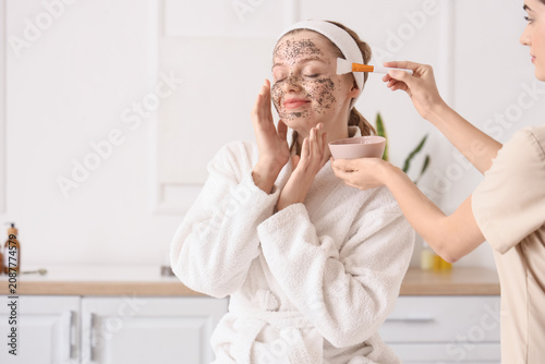 Happy young woman receiving...