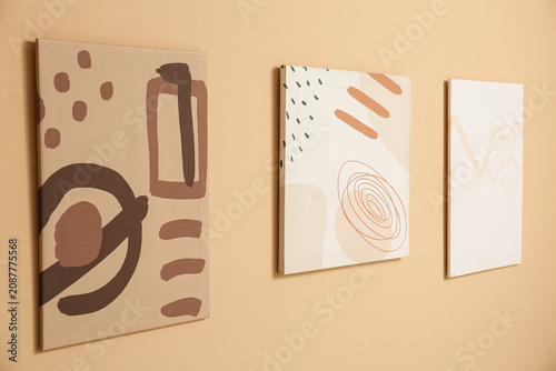 Beautiful paintings on beige wall