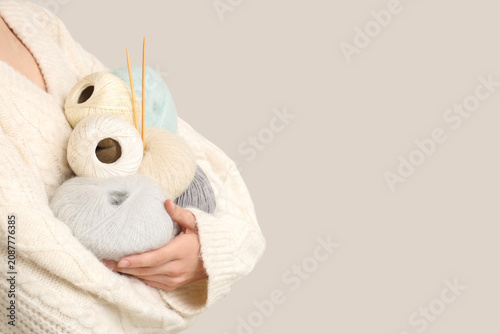 Woman holding colorful knit...
