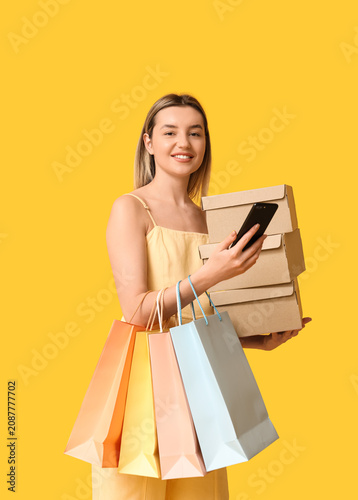 Young woman with mobile pho...