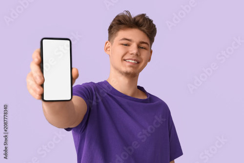 Young man with mobile phone...