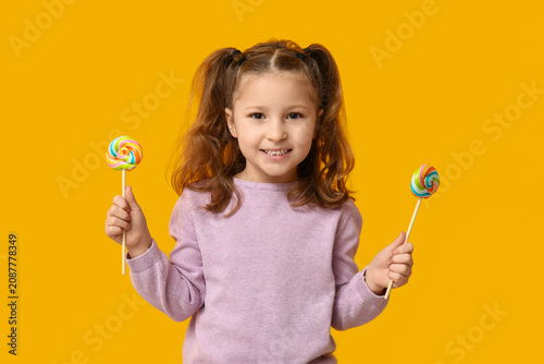 Cute little girl with lolli...