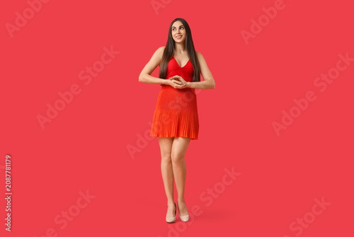 Beautiful young woman in st...