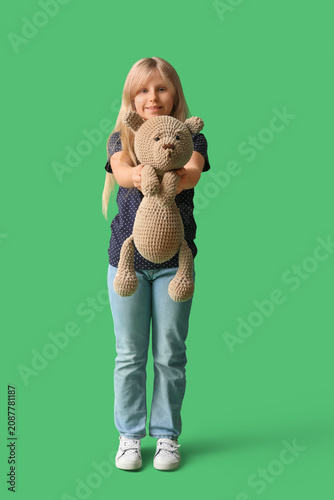 Cute little girl with plush...