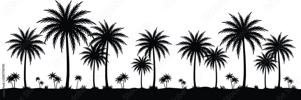Fototapeta premium Tropical palm trees silhouetted against a cloudy sky at sunset silhouettes