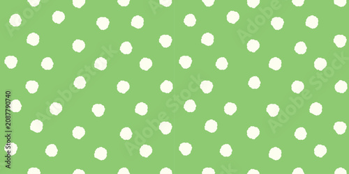 Tableau sur toile Playful seamless pattern with soft white polka dots on fresh green background cr