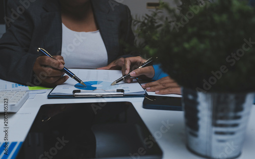 Auditor and accountant team working in office, analyze financial data and accounting record with calculator. Accounting company provide finance and taxation planning for profitable cash flow.