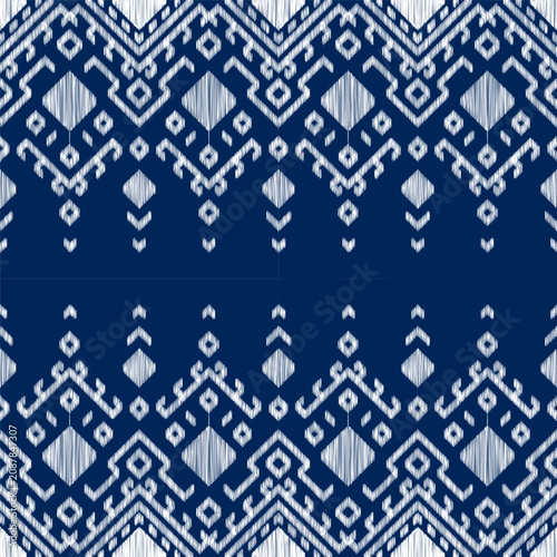Blue white geometric diamond thai seamless ikat traditional ethnic ornament pattern fabric background layout