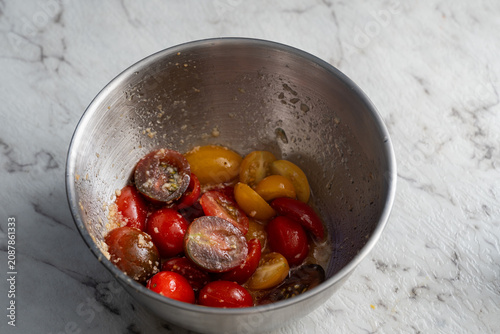 Obraz na płótnie tomatoes marinating in a bowl ready to be cooked