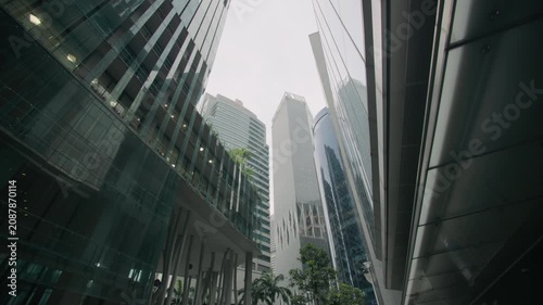 Singapore City business district featuring a high rise building with vertical garden architecture sustainable urban design and modern financial offices in Asia