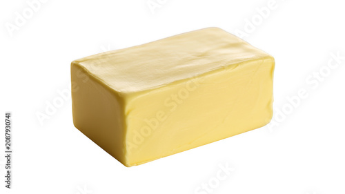 A single rectangular block of yellow butter with a smooth surface, captured from a angle against a black background, for food advertisement