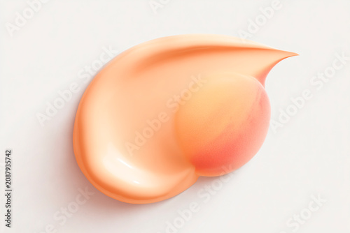Peach cosmetic cream swirl with silky texture
