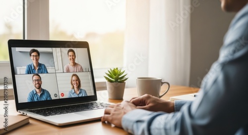 Business team collaborating remotely on a video call using a laptop