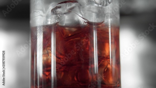 Cuadro en lienzo Dark soda drink with ice and condensation in a glass, providing a cool refreshin