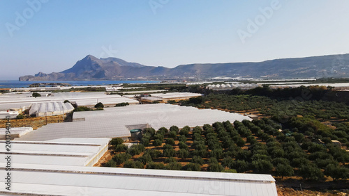 Canvastavla Greenhouses and olive groves creating an agricultural landscape near the Mediter