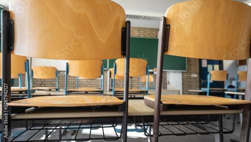 School closed - Empty classroom with chairs stacked on the desks