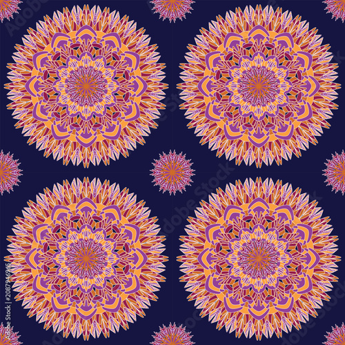 Seamless floral mandala with intricate orange, pink, and purple petals on a deep navy background. Perfect for textiles, wallpaper, apparel, home décor, gift wrap, and stationery.