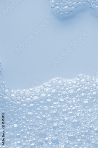Bubbles of body gel or soap foam or shaving gel. Closeup. Copy space
