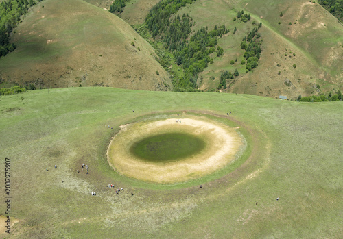 Aerial View of the Eye of Genyen: Natural Pond and Alpine Meadow in Garze, West Sichuan