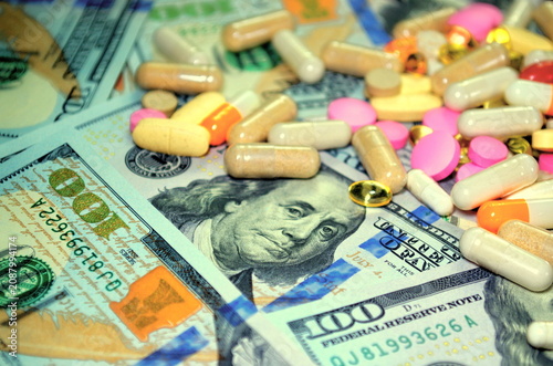 Pills and money background Expensive medicine health insurance Health costs money concept Treatment of diseases. Budget for medical expenses Medical business Health care
