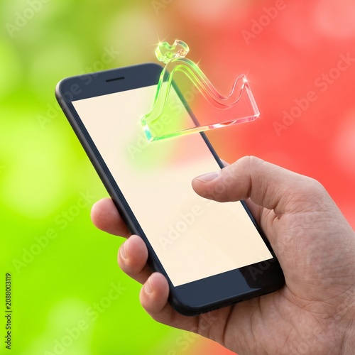 Digital finance icon floating over smartphone held by hand; business investment and mobile banking concept on bokeh background.