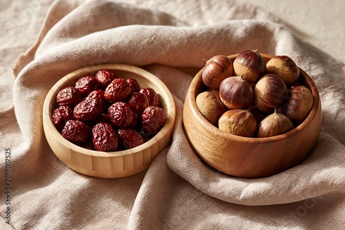 Korean chestnuts and dried jujubes on wooden tray for chuseok ceremonial jesa still life
