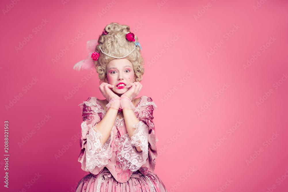 Fototapeta premium Photo of anxious lady princess bite finger nails feel fear wearing medieval style dress costume isolated pink color background