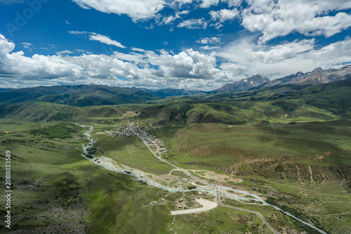 Aerial View of Mount Genyen: Xiazetong Village, Ranrika Village and Alpine Meadows in Summer