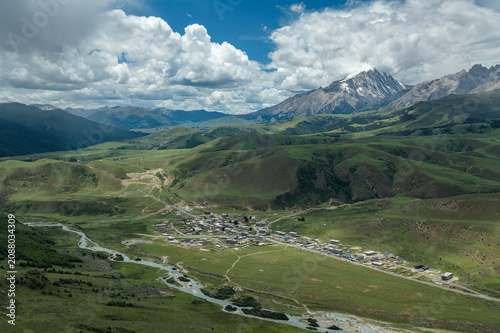 Aerial View of Mount Genyen: Xiazetong Village, Ranrika Village and Alpine Meadows in Summer