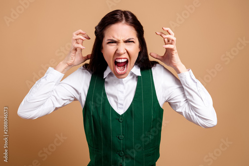 Obraz na plátne Angry woman yelling in frustration with hands raised, emotional portrait of a pr