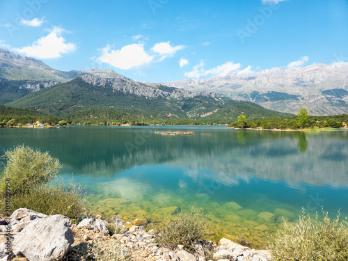 Lake Beysehir turquoise water reflecting mountains and sky in Turkiye